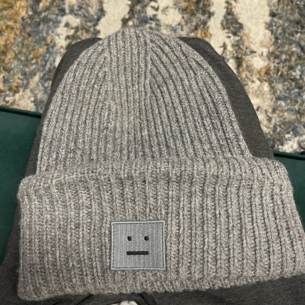 Acne Studios grey melange knit beanie features a large embroidered face logo